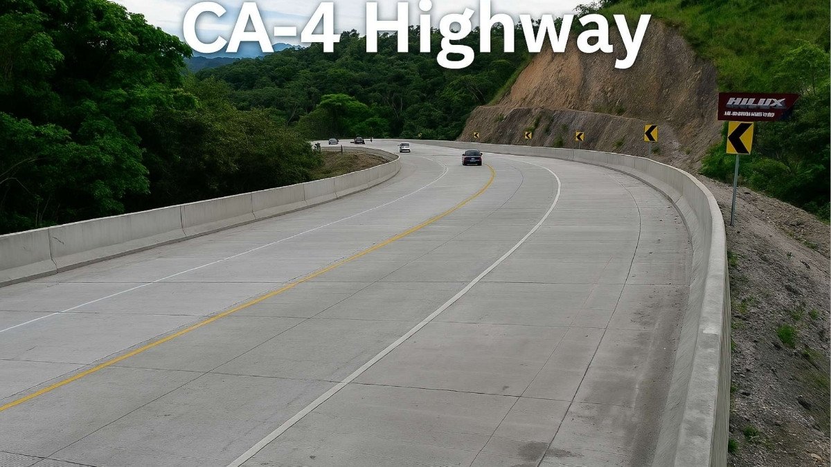 Aerial view of the CA-4 Highway in Honduras, a modern concrete road surrounded by lush green forest and hills